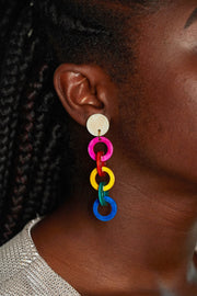 close up image of a model wearing the fiesta earrings dangling about 2 inches below her ear