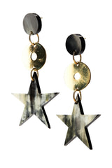 close up image of star drop earrings with natural ethical horn and recycled brass.